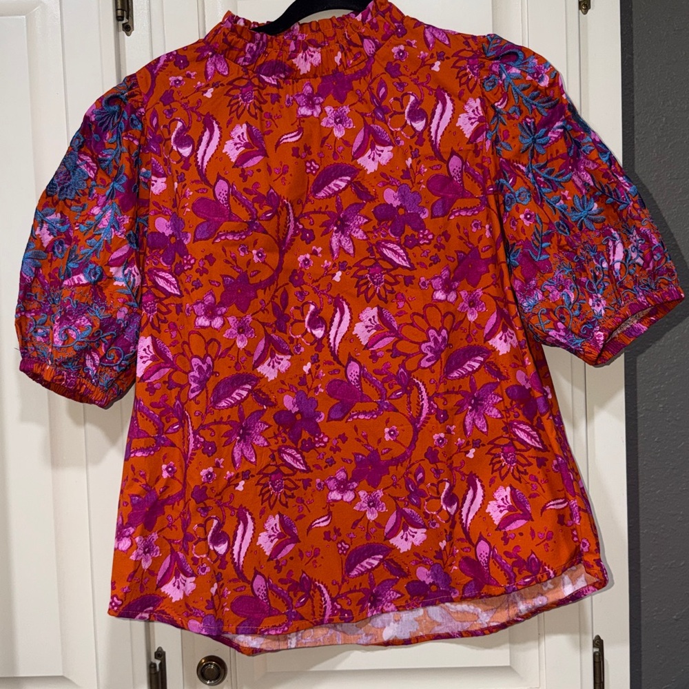 Periwinkle Collection Vibrant Floral Blouse with Puff Sleeves and stitching.